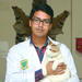 Saifur Rahman holding a cat and wearing a labcoat