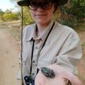 A student holding a bug