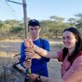 Students undertaking skills training together holding equipment