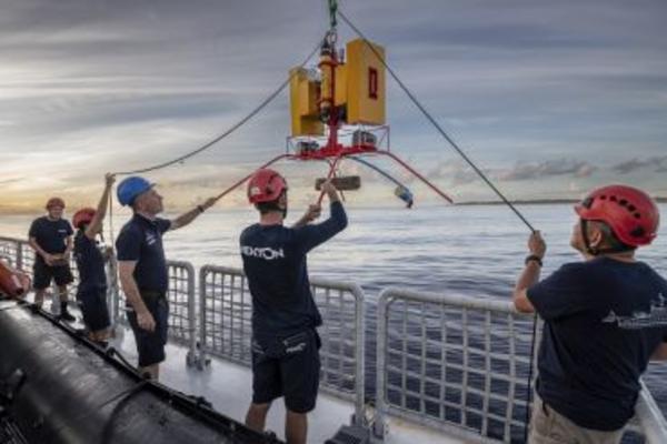 Scientists deploy one of three landers - remote underwater video systems - used during the Nekton Maldives Mission.