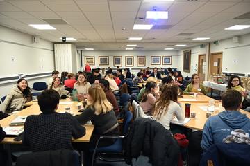 Room full of people in group discussions