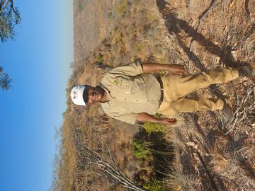 Godfrey Mtare standing outdoors on a hill