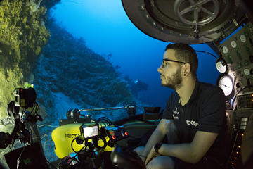 Paris Stefanoudis sits in a submersible