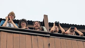 Students with binoculars at a look out