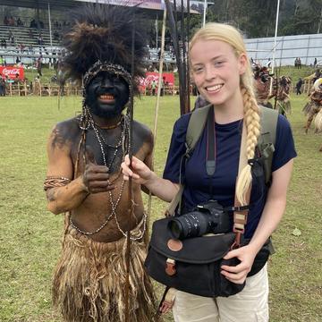 Juliet Turner stands with a participant in the Enga cultural show
